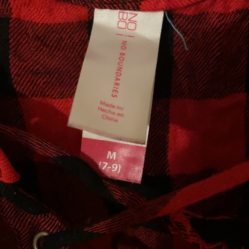 A red and black tank top with cross string over chest - Picture 4 of 7